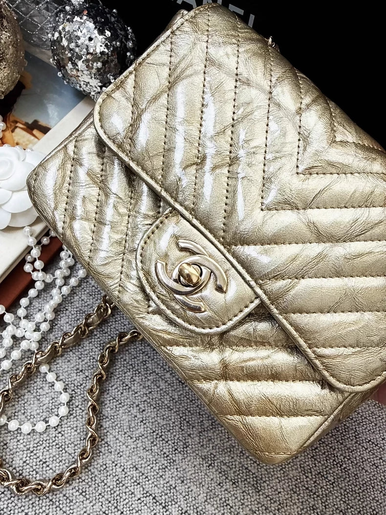 Chanel 2018 gold patent leather mini flap bag