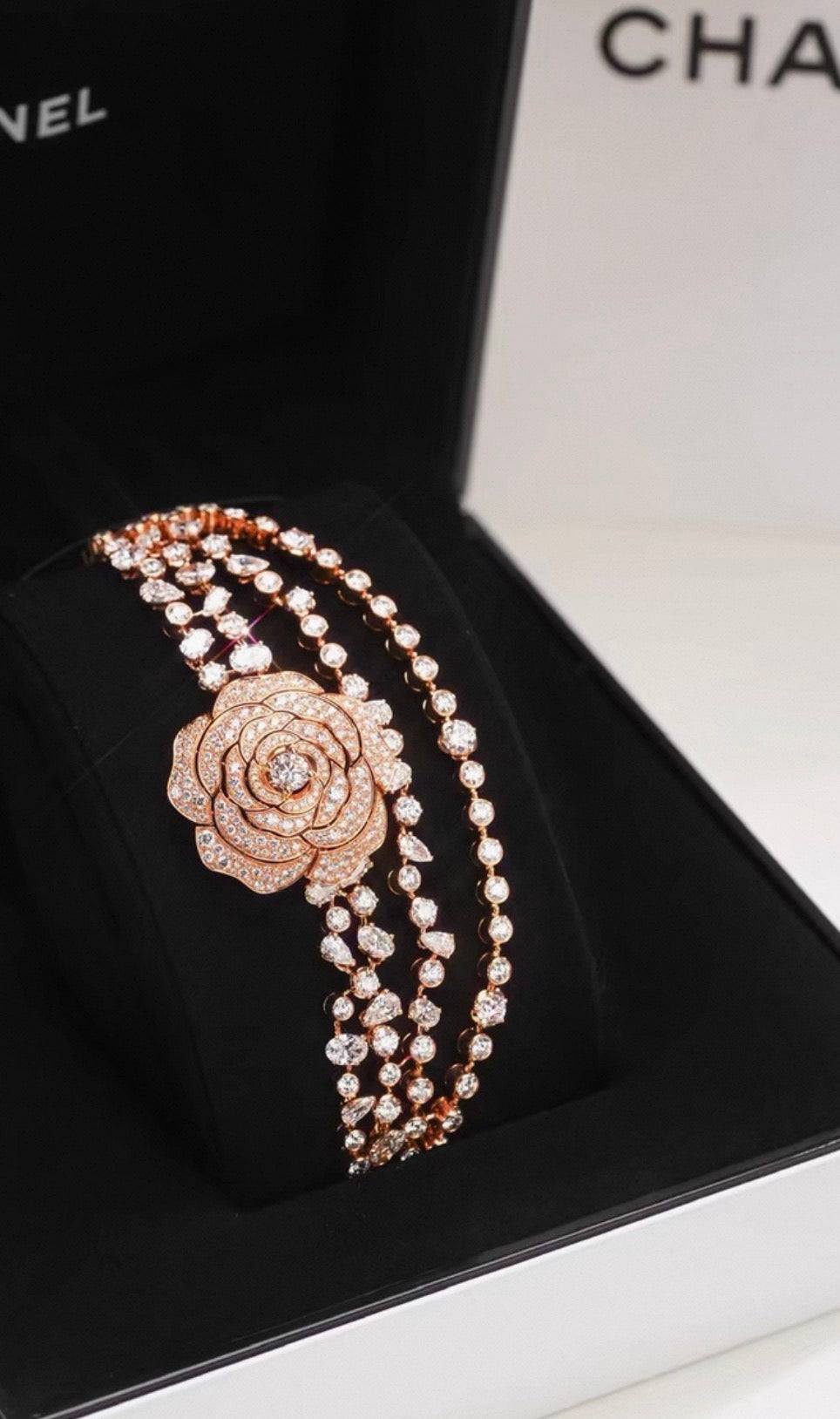 Chanel "Camélia Garden" high jewelry collection features a rose gold tassel chain with full diamonds, detachable camellia brooch, bracelet, and bangle.