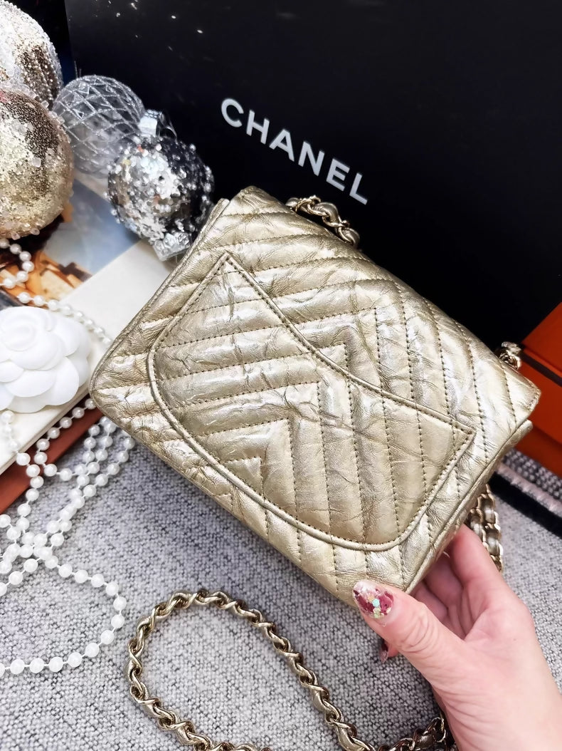 Chanel 2018 gold patent leather mini flap bag
