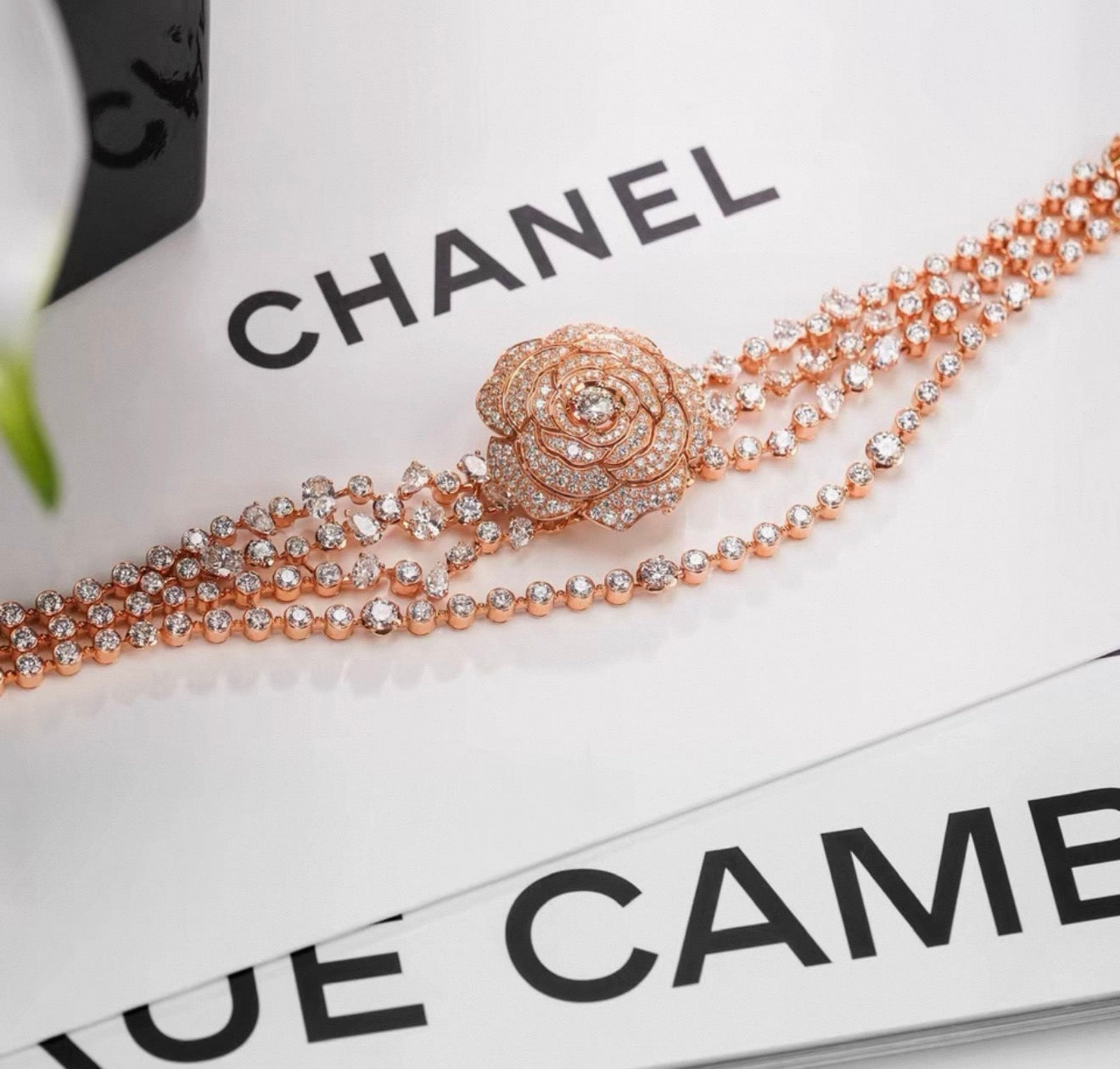 Chanel "Camélia Garden" high jewelry collection features a rose gold tassel chain with full diamonds, detachable camellia brooch, bracelet, and bangle.