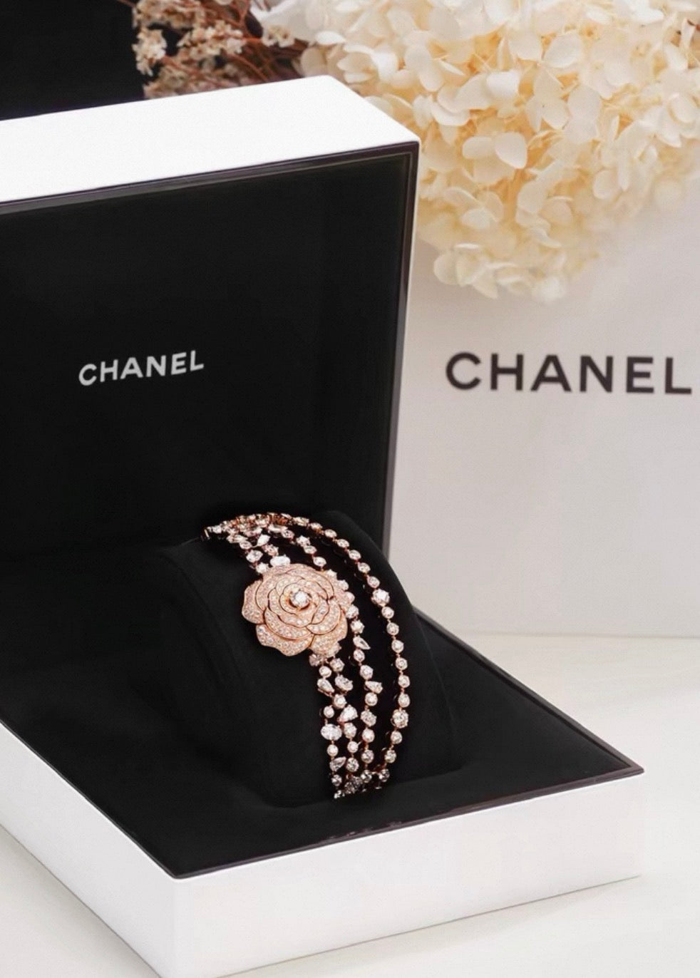 Chanel "Camélia Garden" high jewelry collection features a rose gold tassel chain with full diamonds, detachable camellia brooch, bracelet, and bangle.