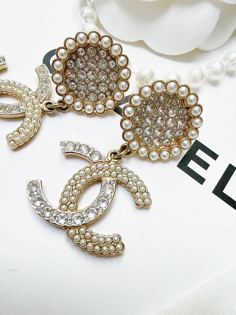 Chanel 21k pearl double C earrings