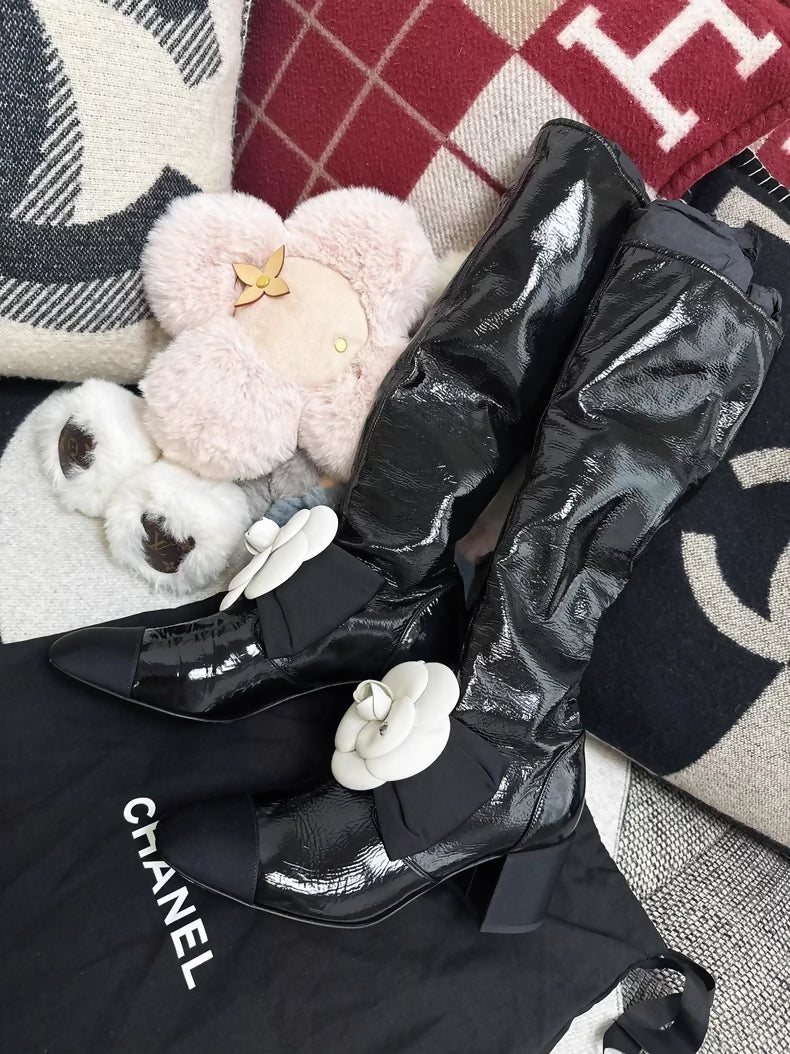 Chanel 23k black patent leather boots
