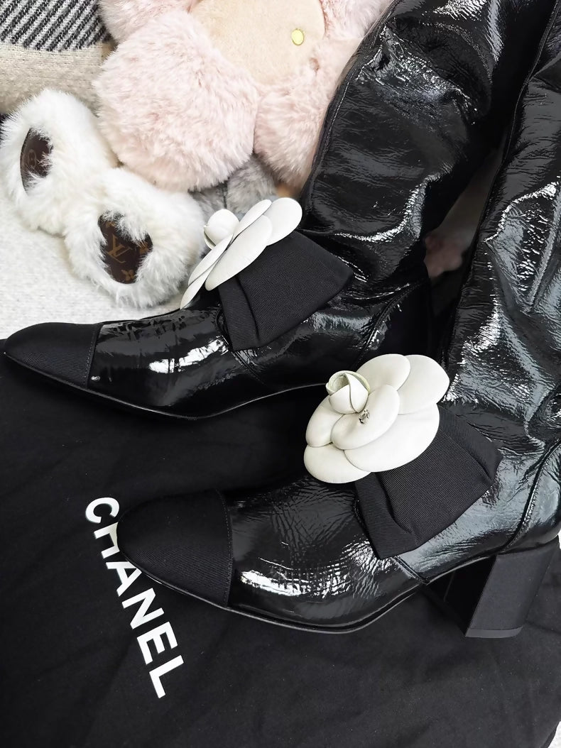 Chanel 23k black patent leather boots
