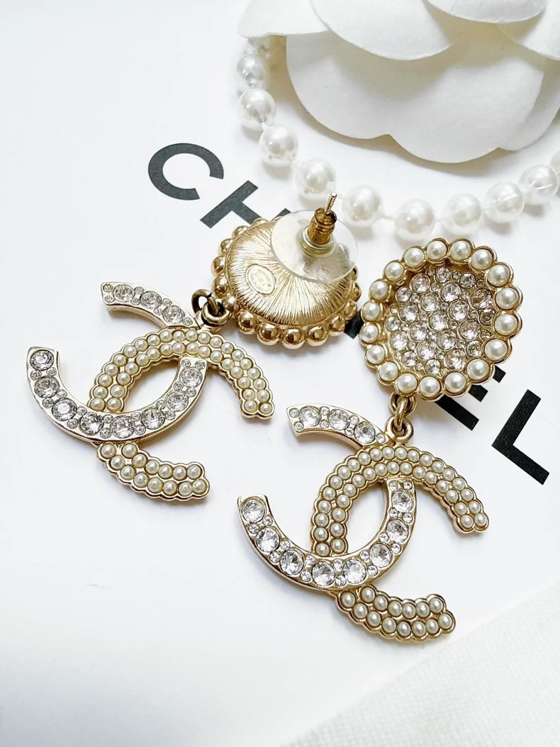 Chanel 21k pearl double C earrings