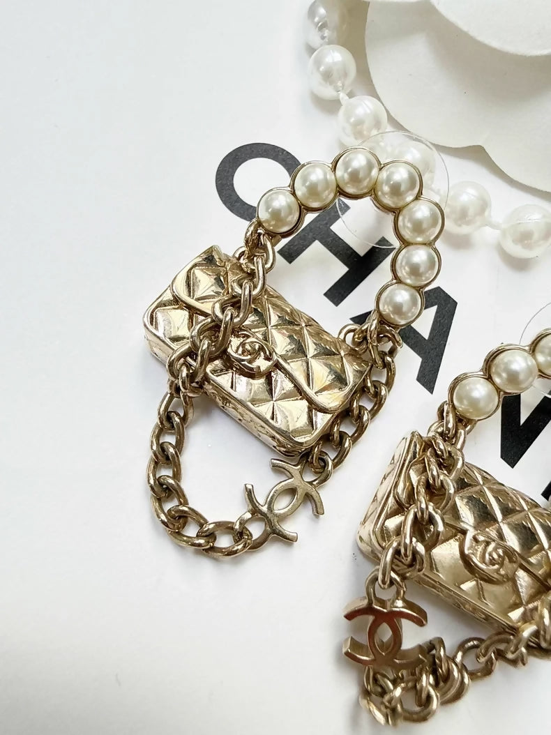 Chanel 21s pearl chain bagvearrings