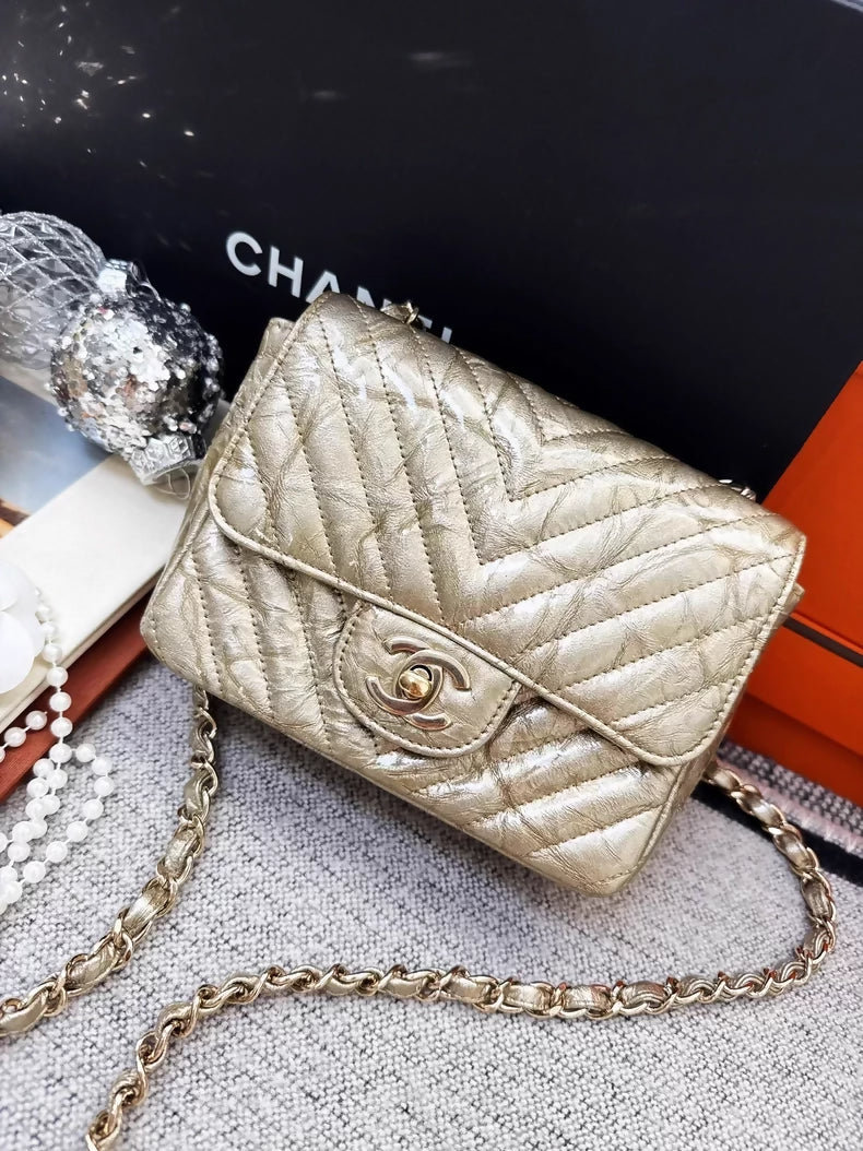 Chanel 2018 gold patent leather mini flap bag