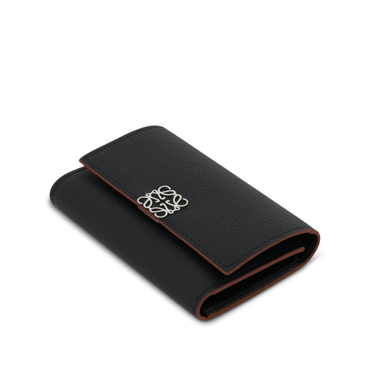 Anagram Small Vertical Wallet in Pebble Grain Calfskin in Black